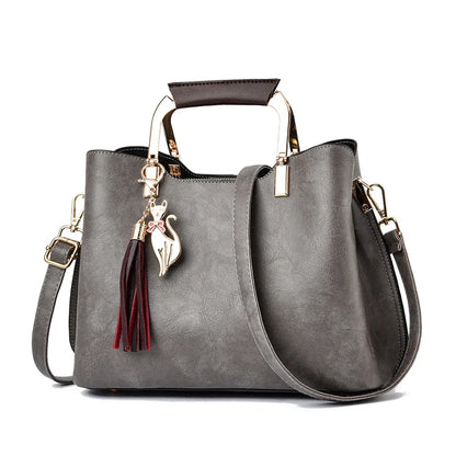Stylish and versatile ladies handbag in black, featuring a horizontal square design with multiple interior compartments for optimal organisation.