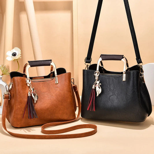 Stylish and versatile ladies handbag in black, featuring a horizontal square design with multiple interior compartments for optimal organisation.
