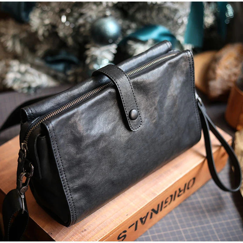 Cowhide one shoulder diagonal fashion bag in black, featuring an adjustable strap and premium leather construction for stylish and practical everyday use.