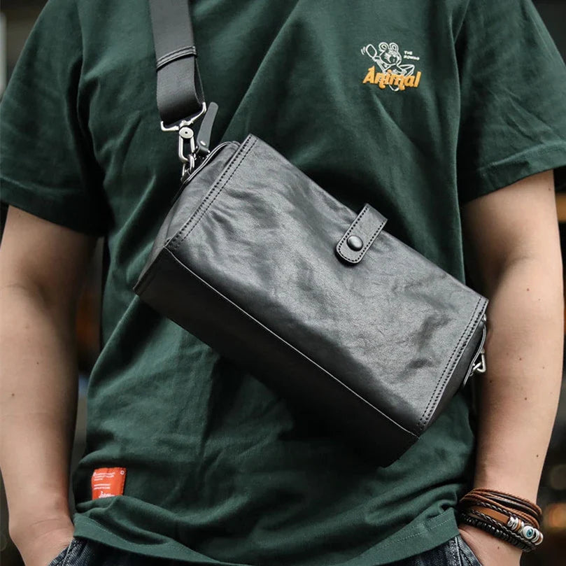 Cowhide one shoulder diagonal fashion bag in black, featuring an adjustable strap and premium leather construction for stylish and practical everyday use.