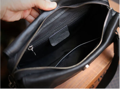 Cowhide one shoulder diagonal fashion bag in black, featuring an adjustable strap and premium leather construction for stylish and practical everyday use.