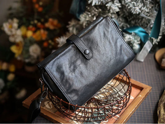 Cowhide one shoulder diagonal fashion bag in black, featuring an adjustable strap and premium leather construction for stylish and practical everyday use.