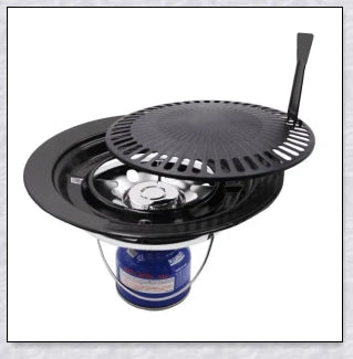 Hunters Creek Portable Korean Outdoor Barbecue Gas Grill Pan with various cooking accessories, including a baking tray, kettle, and pot