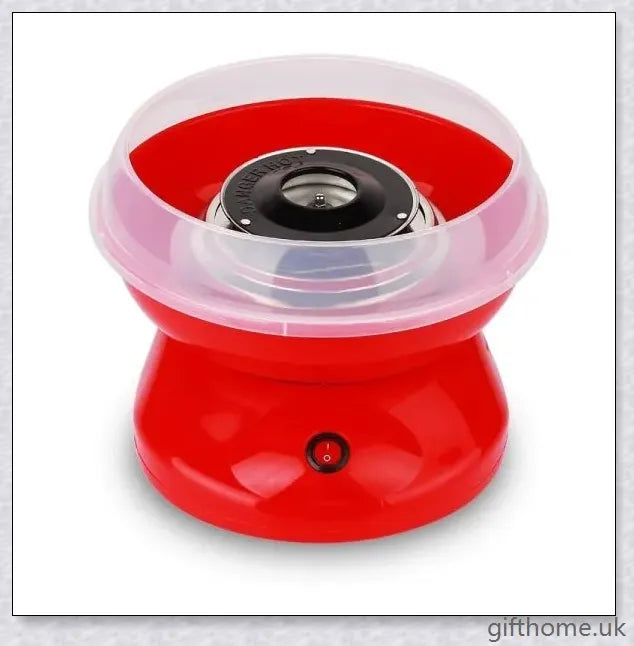 A red cotton candy maker machine on a counter, creating fluffy, cloud-like cotton candy.