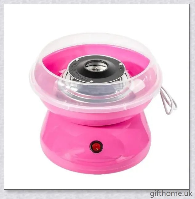 A red cotton candy maker machine on a counter, creating fluffy, cloud-like cotton candy.