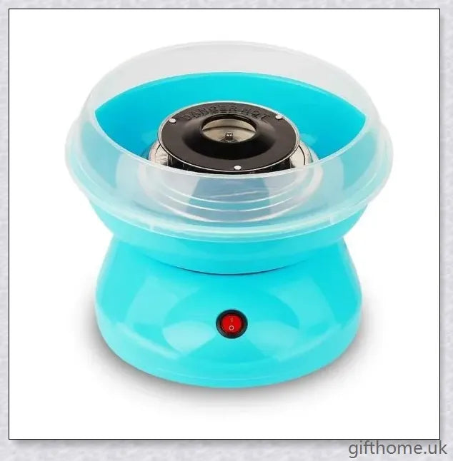 A red cotton candy maker machine on a counter, creating fluffy, cloud-like cotton candy.
