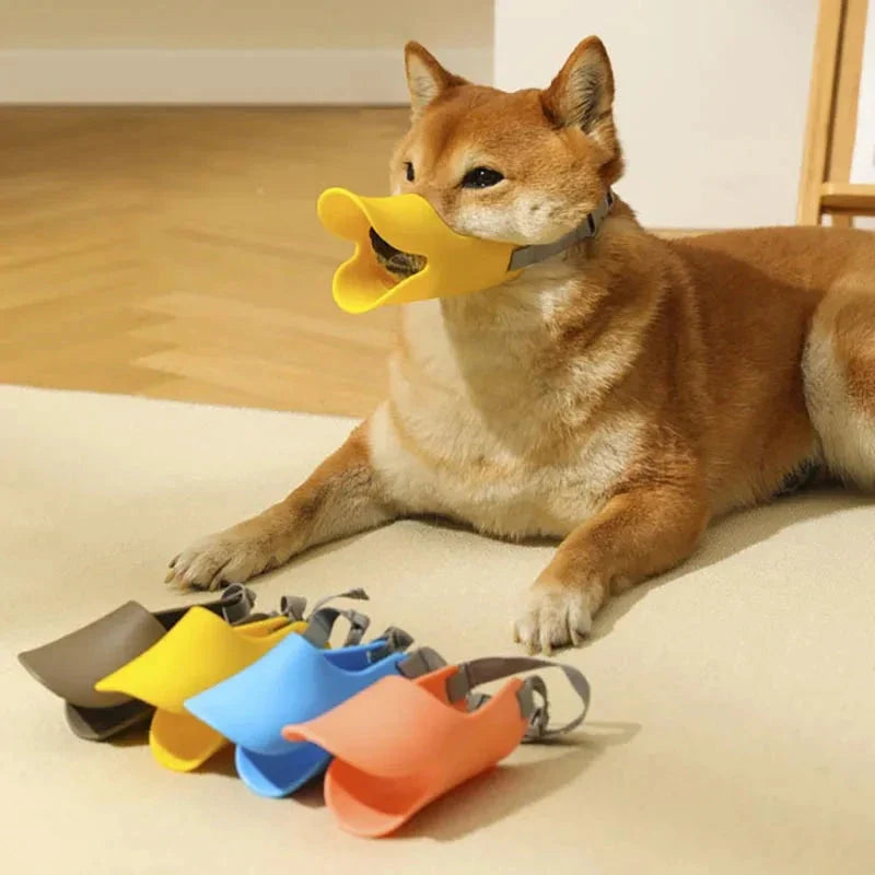 Soft, lightweight, and flexible silicone dog muzzle with a cute duck-bill design for preventing barking, biting, and licking in small to medium-sized dogs