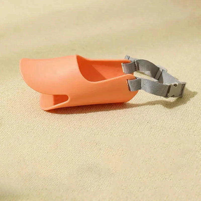 Soft, lightweight, and flexible silicone dog muzzle with a cute duck-bill design for preventing barking, biting, and licking in small to medium-sized dogs