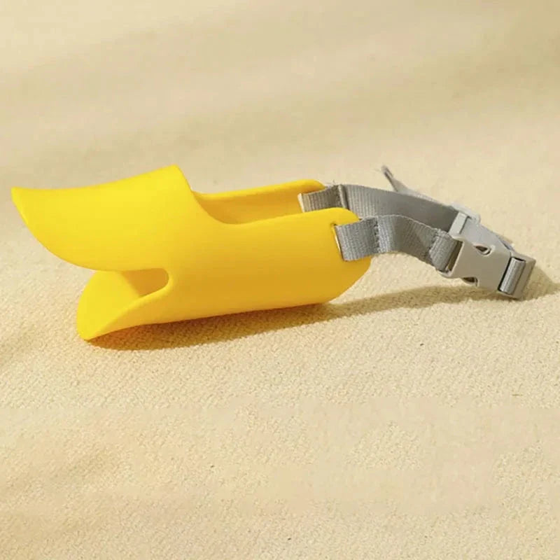 Soft, lightweight, and flexible silicone dog muzzle with a cute duck-bill design for preventing barking, biting, and licking in small to medium-sized dogs