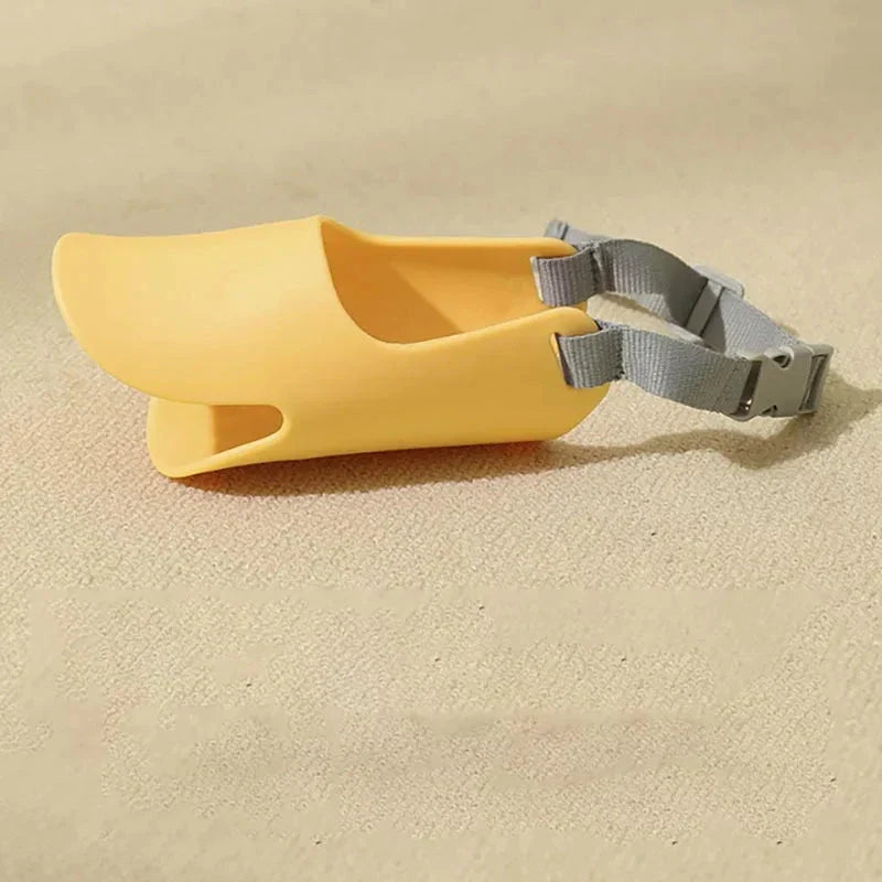 Soft, lightweight, and flexible silicone dog muzzle with a cute duck-bill design for preventing barking, biting, and licking in small to medium-sized dogs
