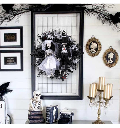 Spooky Halloween decoration featuring a mesh garland with a bride and groom skull design