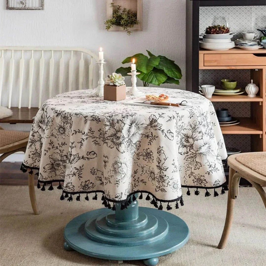 Elegant floral cotton linen round tablecloth with tassels, adding sophisticated charm to any dining setting