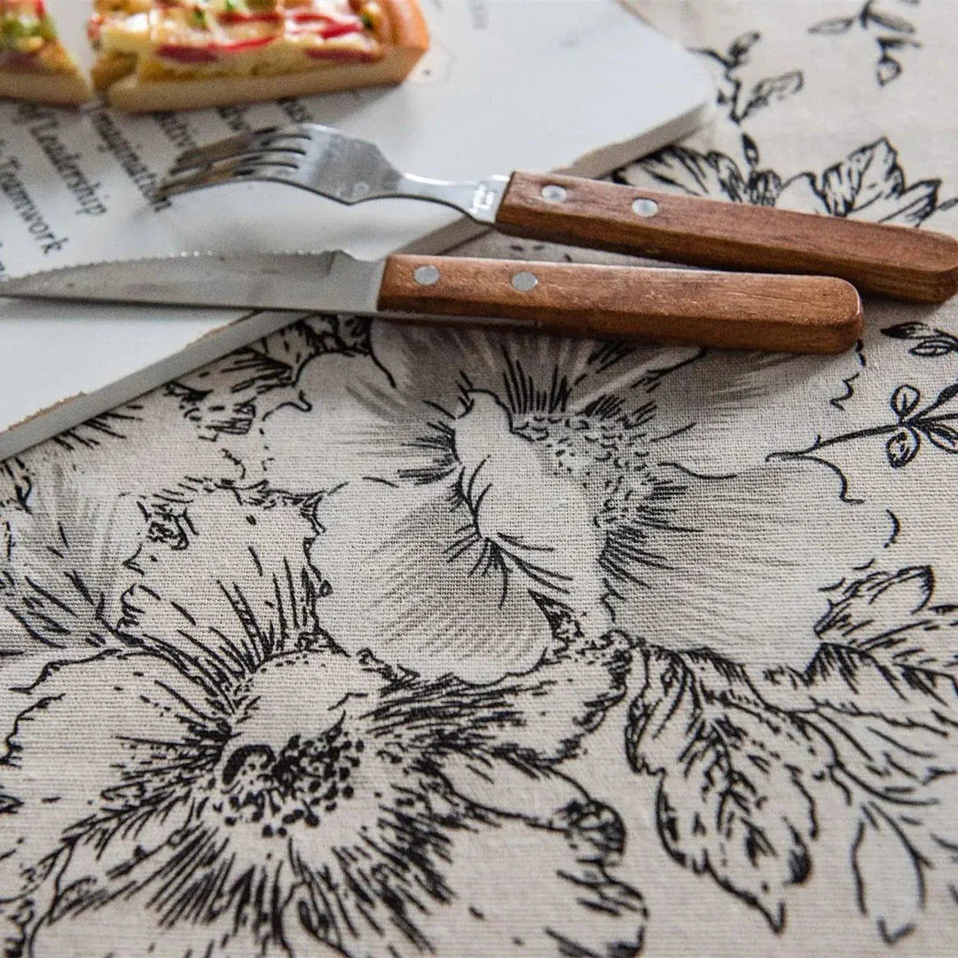 Elegant floral cotton linen round tablecloth with tassels, adding sophisticated charm to any dining setting