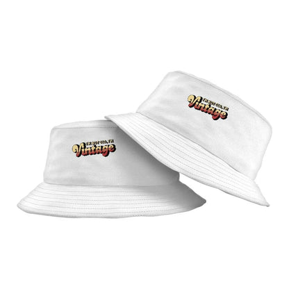 A vintage-inspired graphic bucket hat with a 'I'm Not Old I'm Vintage' design, made from high-quality materials for outdoor activities and casual wear.