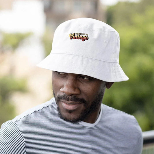 A vintage-inspired graphic bucket hat with a 'I'm Not Old I'm Vintage' design, made from high-quality materials for outdoor activities and casual wear.