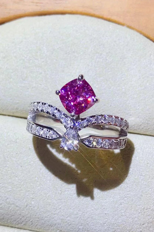 Elegant 1 carat moissanite ring in fuchsia pink, featuring a minimalist design and a lustrous platinum-plated finish