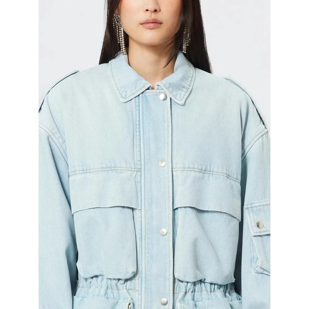 Model wearing a stylish patchwork denim jacket with practical pockets and a refined collar design