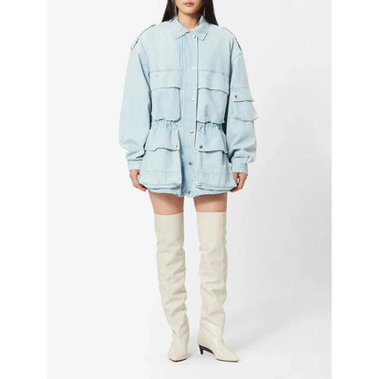 Model wearing a stylish patchwork denim jacket with practical pockets and a refined collar design