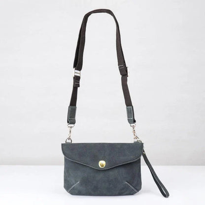 A vintage-inspired brown leather messenger bag with an adjustable strap and multiple interior compartments for organisation and storage.