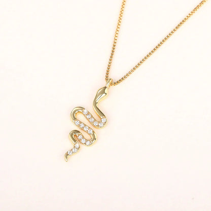 Snake pendant necklace with zirconia stones in white gold and gold finishes