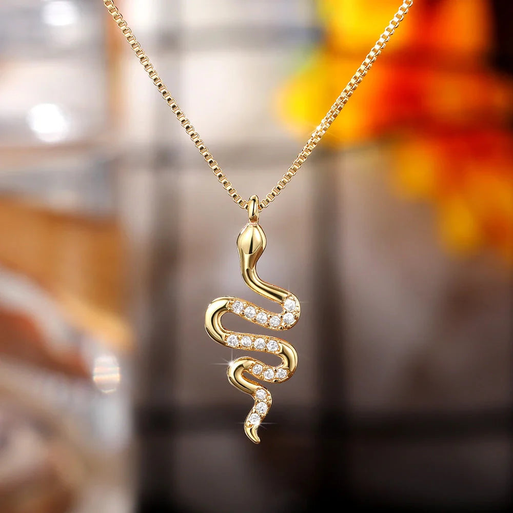 Snake pendant necklace with zirconia stones in white gold and gold finishes