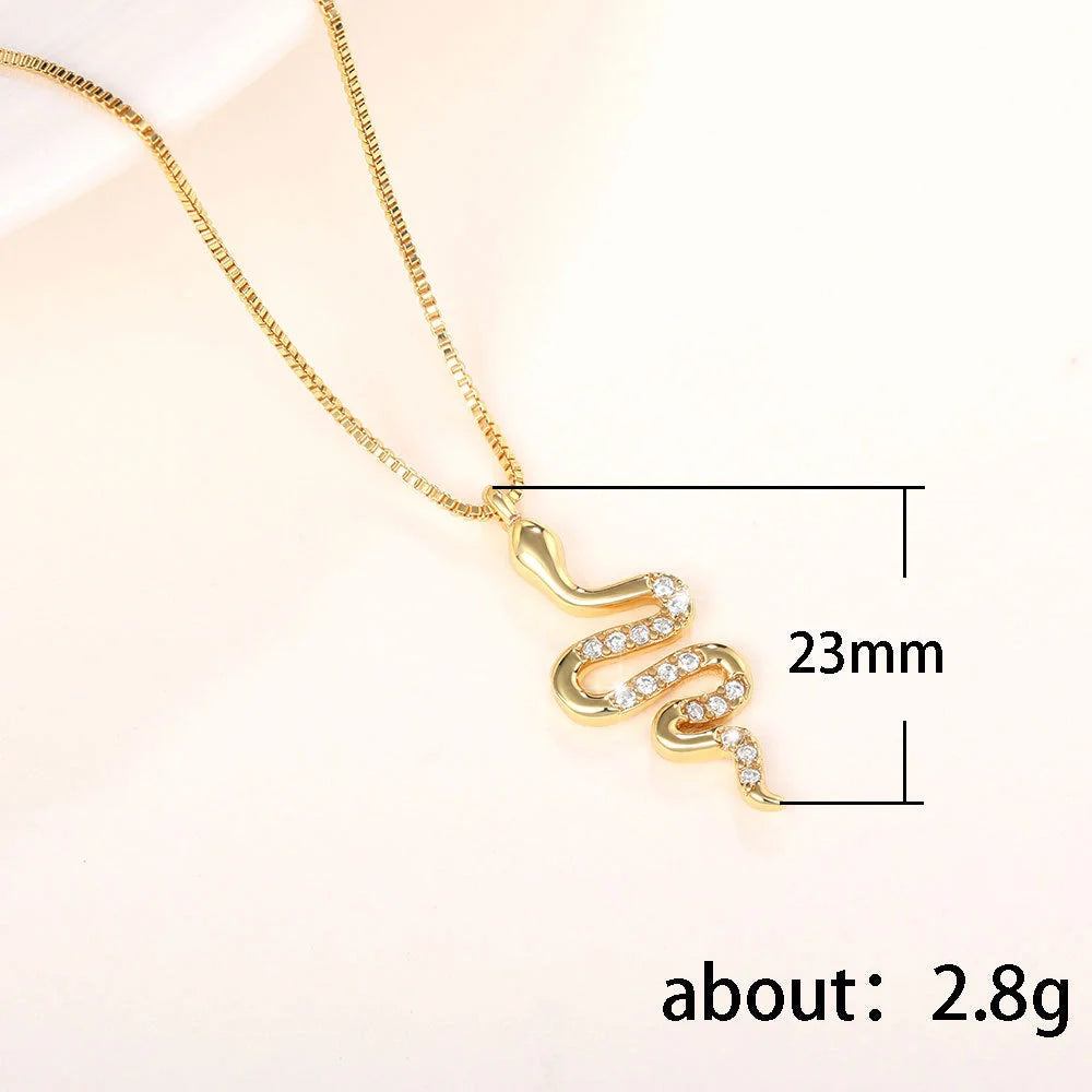 Snake pendant necklace with zirconia stones in white gold and gold finishes