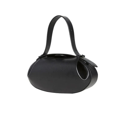 Elegant round vegan leather handbag with a distinctive circular shape, durable construction, and spacious interior organisation