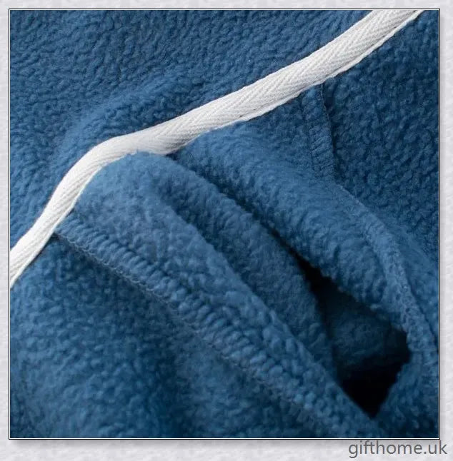 A cosy blue hoodie with a dinosaur design, perfect for young boys