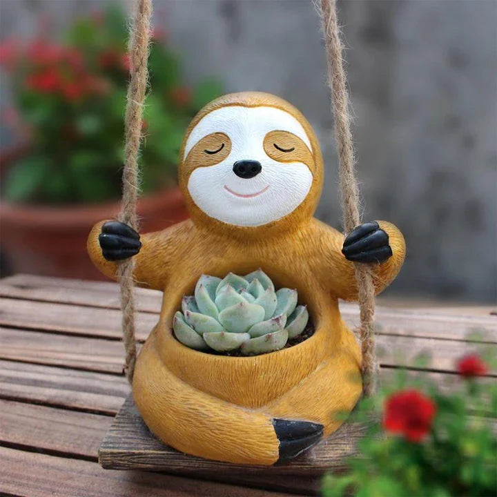 Charming swing sloth planter made of high-quality resin, perfect for adding greenery and whimsy to home and garden decor.