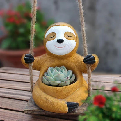Charming swing sloth planter made of high-quality resin, perfect for adding greenery and whimsy to home and garden decor.