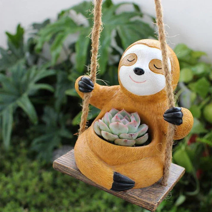 Charming swing sloth planter made of high-quality resin, perfect for adding greenery and whimsy to home and garden decor.
