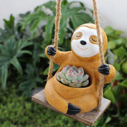 Charming swing sloth planter made of high-quality resin, perfect for adding greenery and whimsy to home and garden decor.