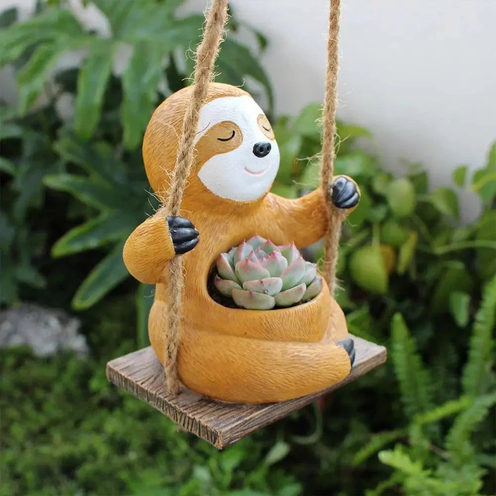 Charming swing sloth planter made of high-quality resin, perfect for adding greenery and whimsy to home and garden decor.
