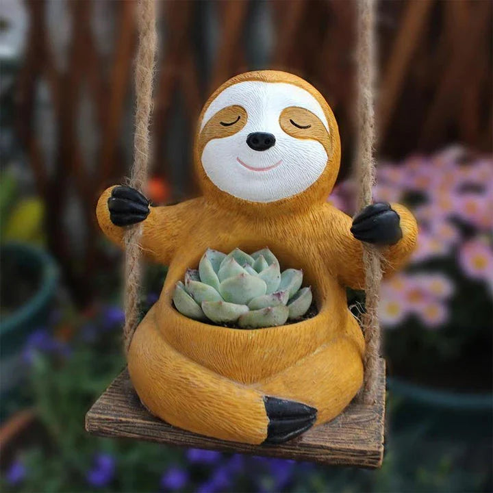 Charming swing sloth planter made of high-quality resin, perfect for adding greenery and whimsy to home and garden decor.