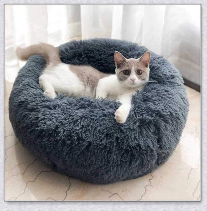 Round and raised cat marshmallow bed in white and grey colours, designed to promote healthy and restful sleep for cats
