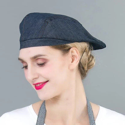 A long denim apron with a matching cooking hat, designed to provide a professional and stylish look for home cooking and baking enthusiasts.