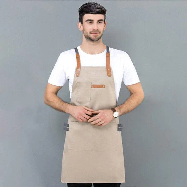A long denim apron with a matching cooking hat, designed to provide a professional and stylish look for home cooking and baking enthusiasts.