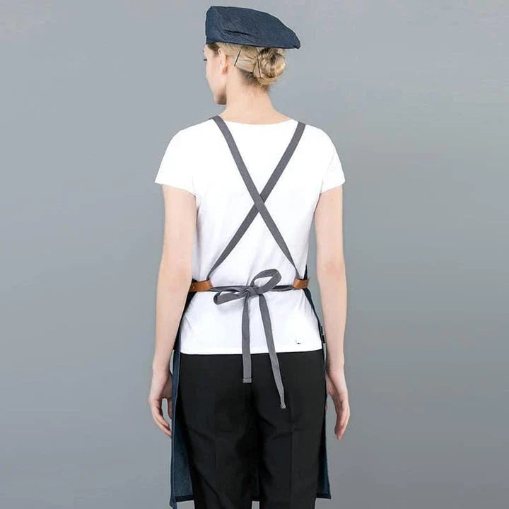 A long denim apron with a matching cooking hat, designed to provide a professional and stylish look for home cooking and baking enthusiasts.