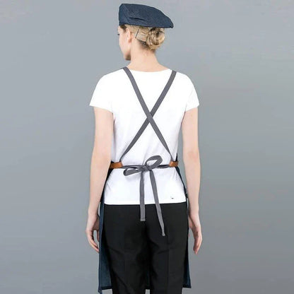 A long denim apron with a matching cooking hat, designed to provide a professional and stylish look for home cooking and baking enthusiasts.