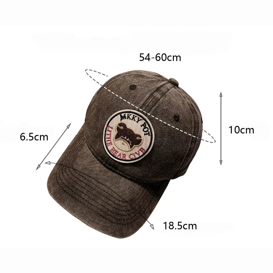 Two pink baseball caps with a cartoon love design, perfect for both women and men to add a touch of playful personality to their outfits.