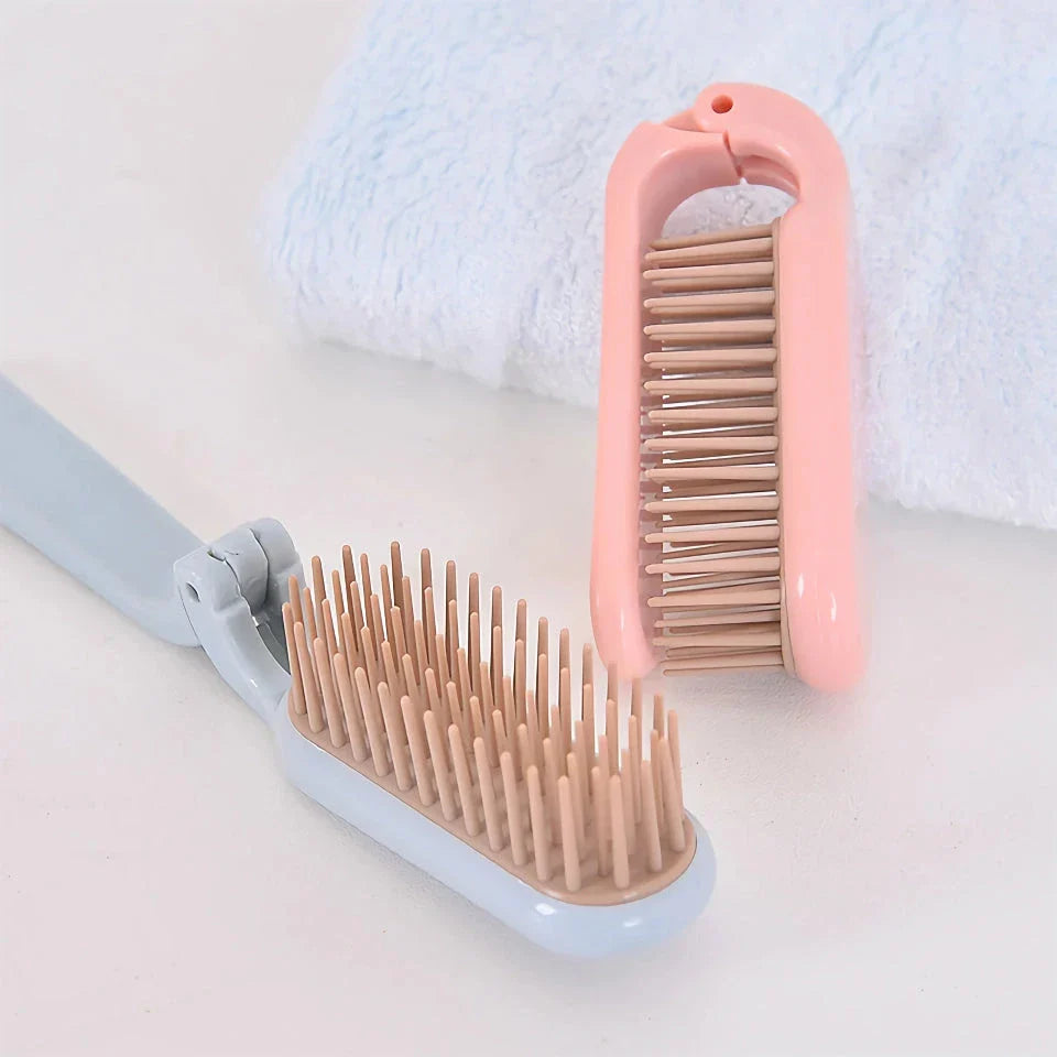 Compact, foldable hair brush with built-in scalp massager for convenient hair care on the go