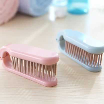Compact, foldable hair brush with built-in scalp massager for convenient hair care on the go