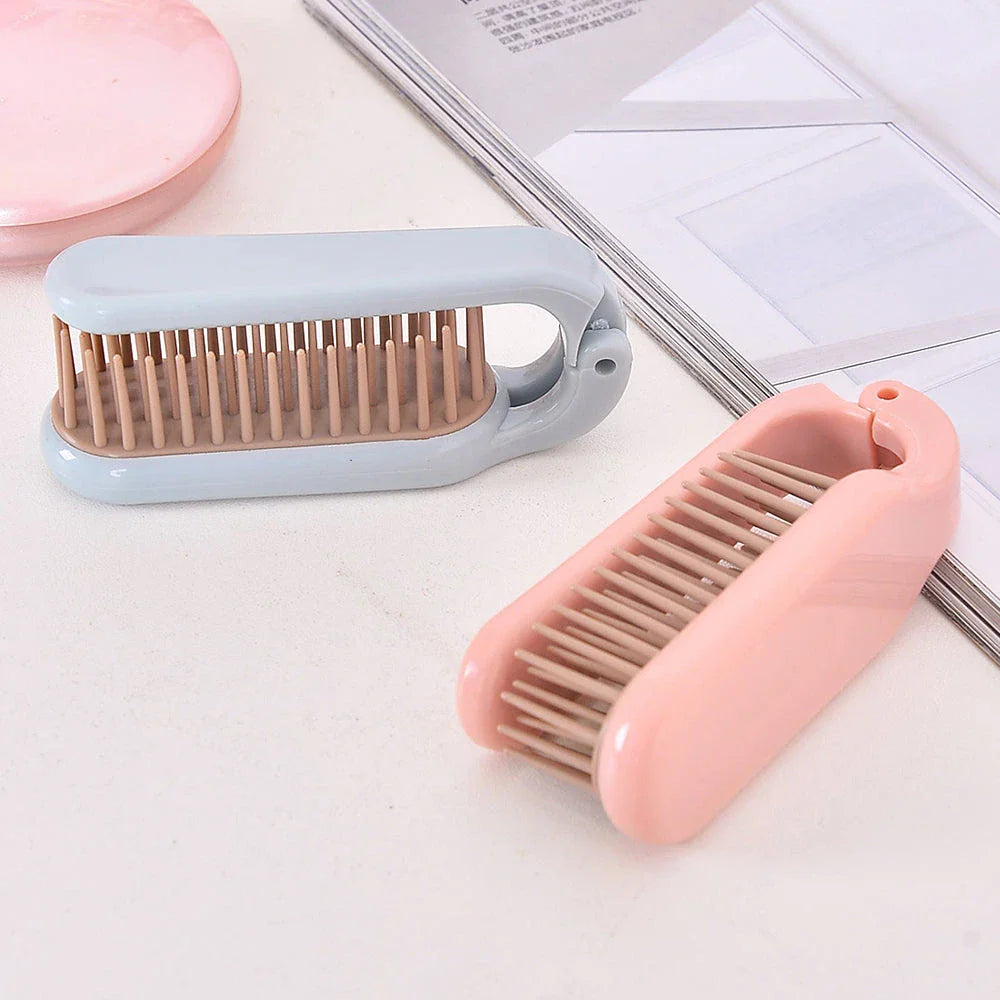 Compact, foldable hair brush with built-in scalp massager for convenient hair care on the go