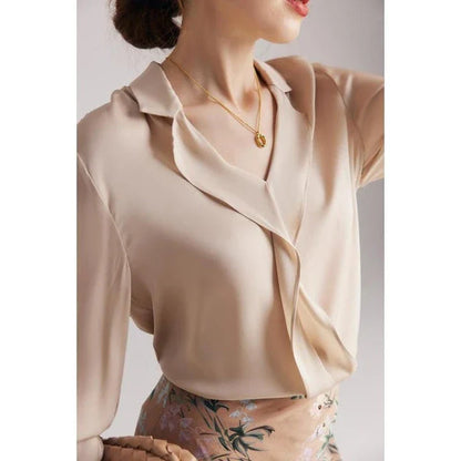 Elegant ruffled v-neck silk blouse in a champagne colour, featuring a straight and regular fit design for a timeless look.