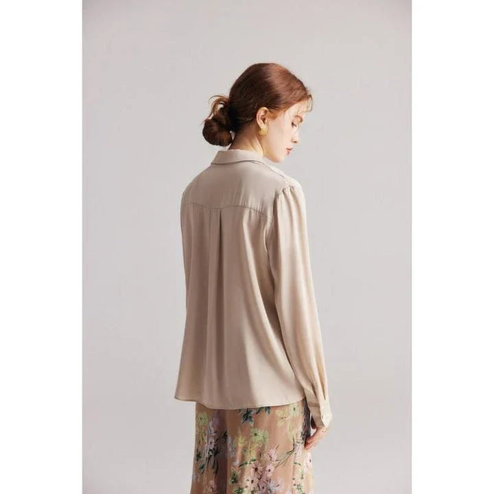 Elegant ruffled v-neck silk blouse in a champagne colour, featuring a straight and regular fit design for a timeless look.