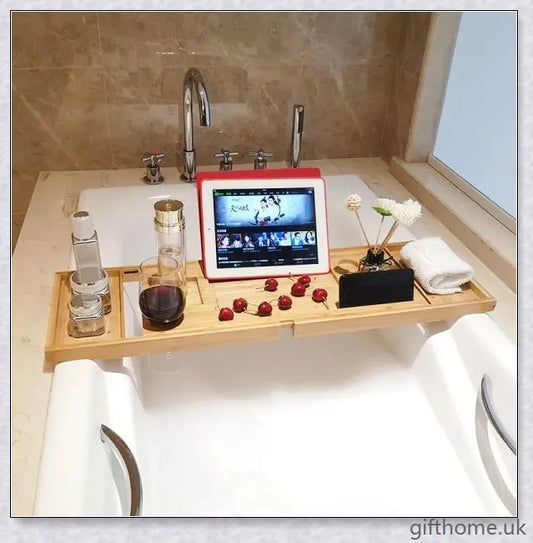 Bamboo bathtub storage rack with essential toiletries neatly arranged on the shelves
