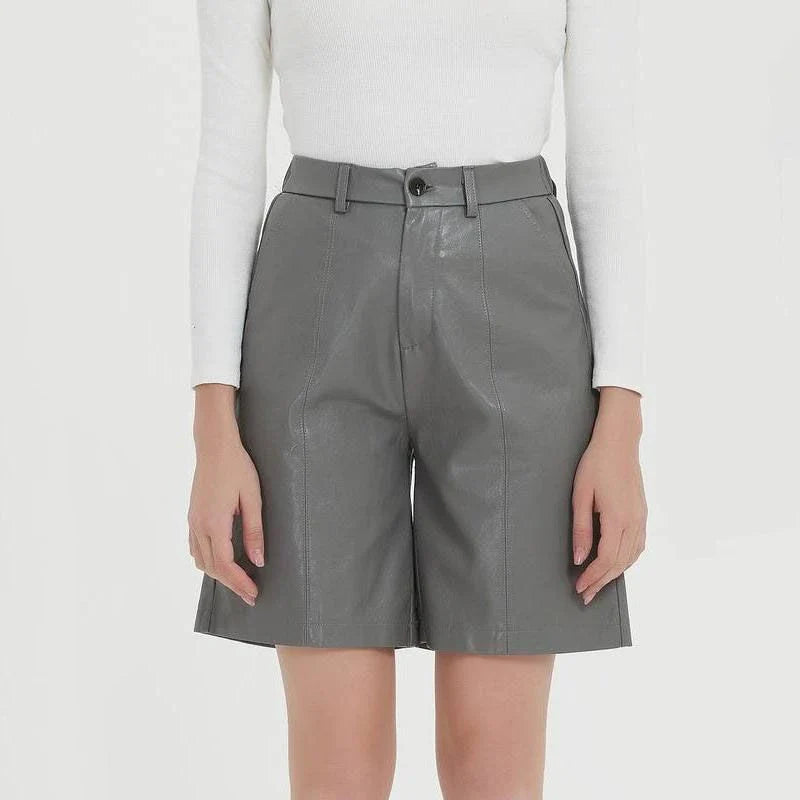 Elegant knee-length PU leather shorts for women in gray, featuring a regular fit design with a mid-rise waist and elastic waistband for maximum comfort and style.