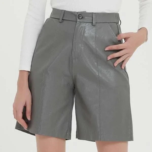 Elegant knee-length PU leather shorts for women in gray, featuring a regular fit design with a mid-rise waist and elastic waistband for maximum comfort and style.