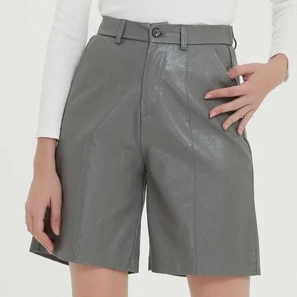 Elegant knee-length PU leather shorts for women in gray, featuring a regular fit design with a mid-rise waist and elastic waistband for maximum comfort and style.
