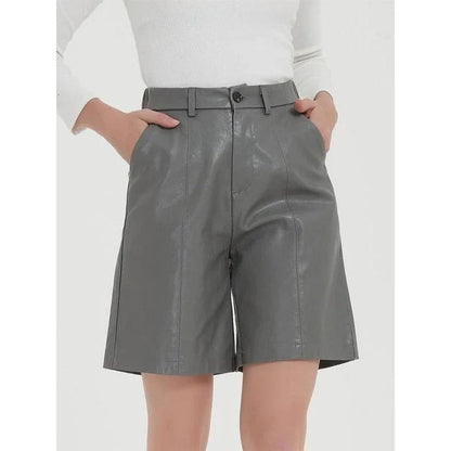 Elegant knee-length PU leather shorts for women in gray, featuring a regular fit design with a mid-rise waist and elastic waistband for maximum comfort and style.